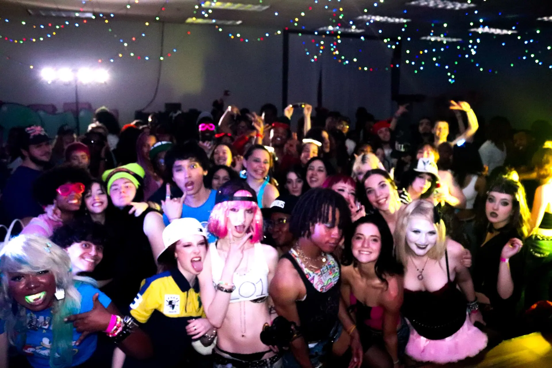 Big group photo in costume at a cosplay rave